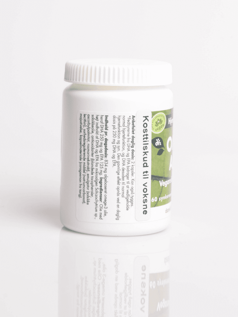 Weiße Dose mit grünem Vegan-Etikett und dem Hinweis Nahrungsergänzungsmittel für Erwachsene, mit Spiegelung auf weißem Hintergrund